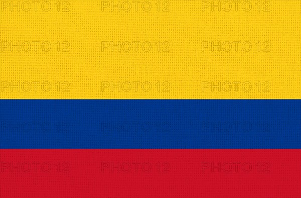 Close-up of a textured flag with horizontal yellow, blue, and red stripes, Flag of Colombia.