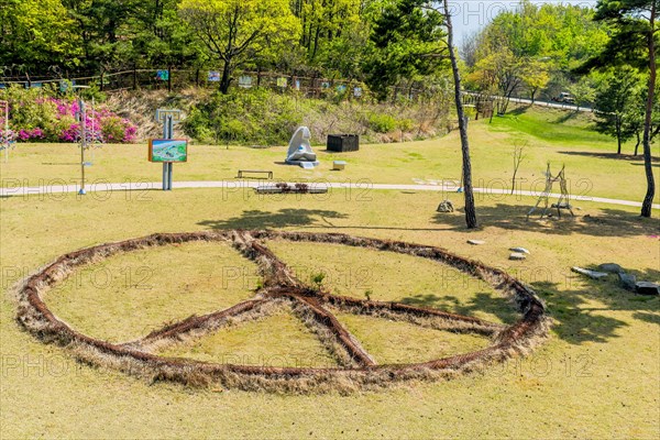 Sculpture: Peace, by Victor Choi, made of rusted metal at DMZ Peace Park in Goseong, South Korea,