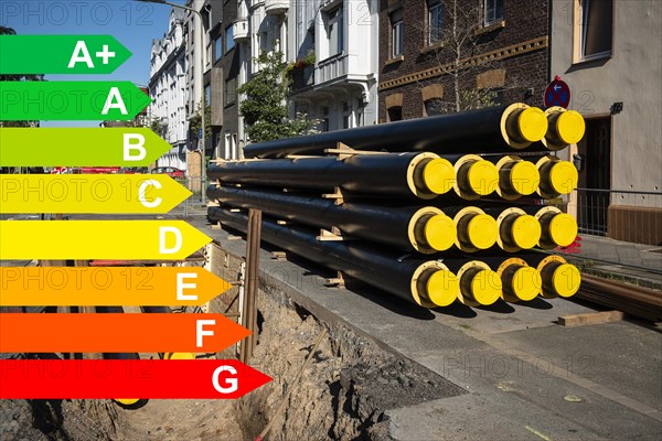 A stack of new pipes for district heating at a construction site, graphic with energy efficiency