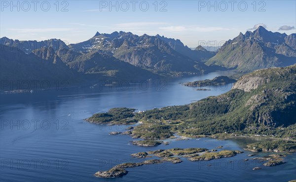 View of coast in Raftsund fjord and mountains in the evening light, view from the top of