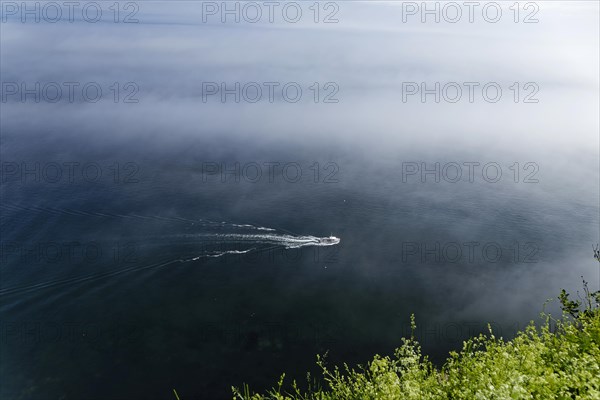 Coastal seascape, fishing boat in fog, Gulf of Saint Lawrence, Province of Quebec, Canada, sea,
