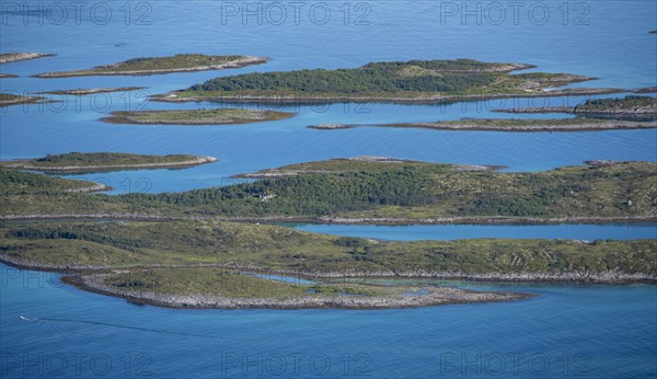 Rocky islands in the blue sea, sea with archipelago islands, Ulvagsundet, Vesteralen, Norway,