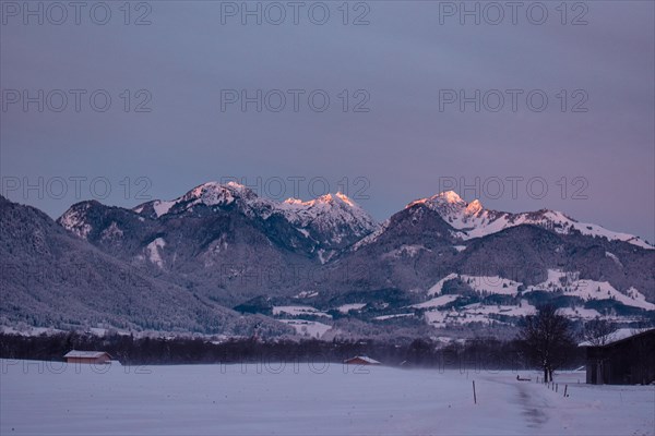 Snowy landscape at sunrise with mountain panorama, view of Wendelstein, Nussdorf, Bavaria, Germany,