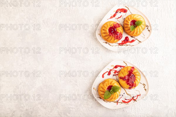 Semolina cheesecake with strawberry jam, lavender on gray concrete background. top view, flat lay,