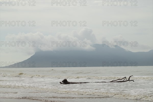 Bako national park, sea sandy beach, waves, overcast, cloudy day, sky and sea. Vacation, travel,