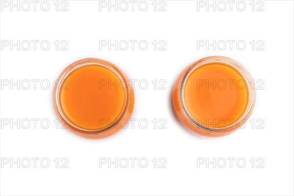 Baby puree with fruits mix, pumpkin, persimmon, mango infant formula in glass jar isolated on white