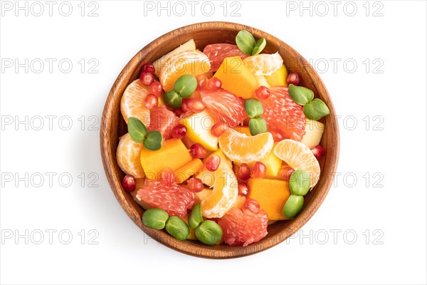 Vegetarian fruit salad of pumpkin, tangerine, pomegranate, grapefruit, sunflower microgreen sprouts