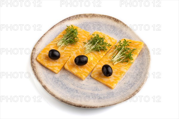 Marble cheese with olives and watercress microgreen isolated on white background. side view, close