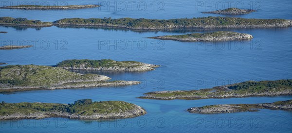 Rocky islands in the blue sea, sea with archipelago islands, Ulvagsundet, Vesteralen, Norway,