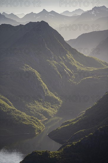 Fjord landscape with atmospheric evening light, Ulvagfjorden fjord and mountains, view from the top