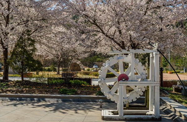 Hwanggan, South Korea, April 8, 2020: For editorial use only. Closeup of white wooden waterwheel