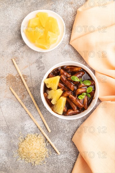 Tteokbokki or Topokki, fried rice cake stick, popular Korean street food with spicy jjajang sauce