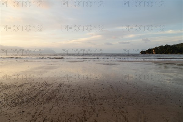 Bako national park, sea sandy beach, overcast, cloudy sunset, sky and sea, low tide. Vacation,