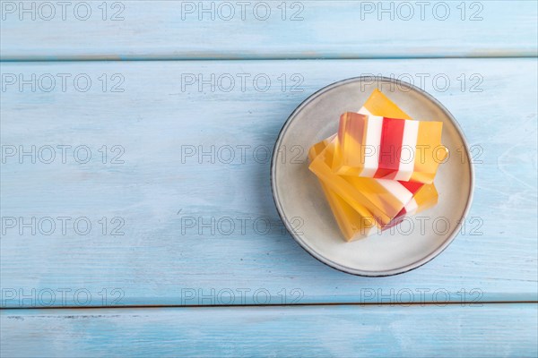 Almond milk and peach jelly on blue wooden background. top view, flat lay, copy space