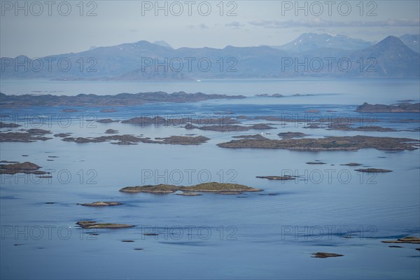 View of the sea with archipelago islands from Svellingsflaket and mountains, from Dronningsvarden