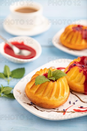 Semolina cheesecake with strawberry jam, lavender, cup of coffee on blue wooden background. side