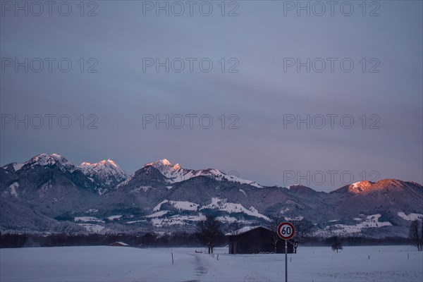 Snowy landscape at sunrise with mountain panorama, view of Wendelstein, Nussdorf, Bavaria, Germany,