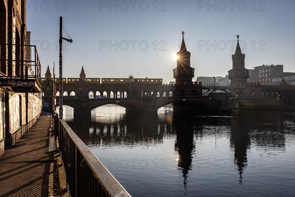 Oberbaum Bridge, underground train BVG, backlight shot sun, Friedrichshain-Kreuzberg, Berlin,