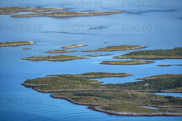 Rocky islands in the blue sea, sea with archipelago islands, Ulvagsundet, Vesteralen, Norway,