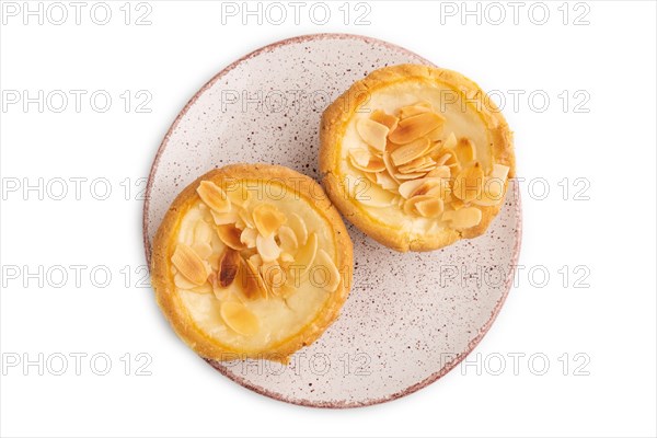 Traditional portuguese cakes pasteis de nata, custard small pies with almonds isolated on white