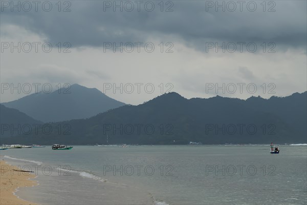 Lombok and Gili Air islands, overcast, cloudy day, sky and sea. Vacation, travel, tropics concept,