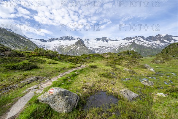 Hiking trail in picturesque mountain landscape, mountain peaks with snow and glacier Hornkees and