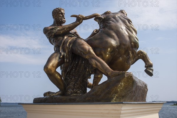 Bronzed cast zinc sculpture, statue, Heracles, taming the Cretan bull, artist: August Kriesmann,