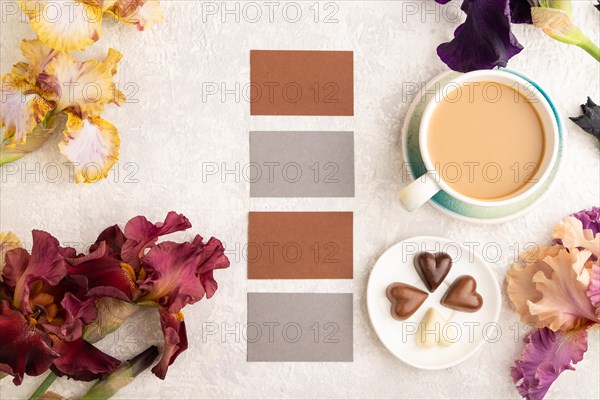 Set of gray and brown business cards with cup of cioffee, chocolate candies, purple and burgundy