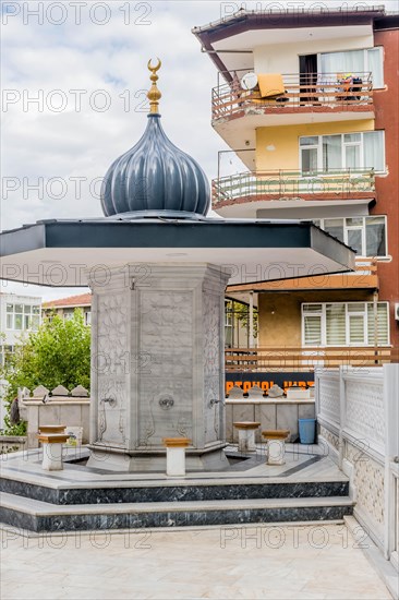 Public ablution fountain in courtyard of urban mosque in Istanbul, Turkiye