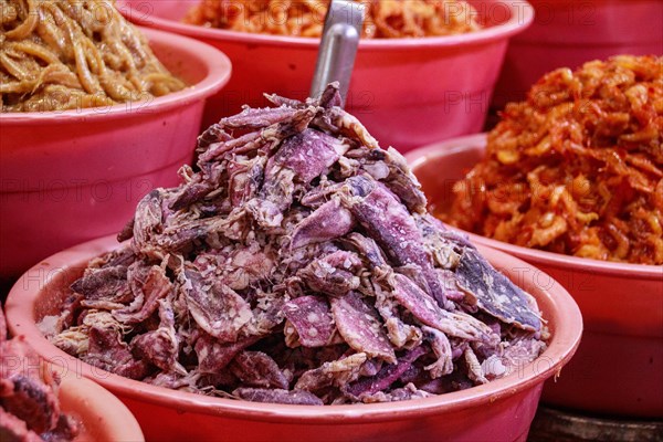 Fermented salted squids and shrimps displayed and sold at the local Samaki Market showing the