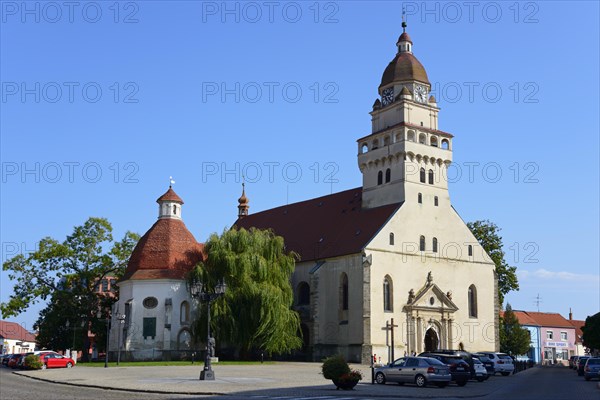 A Gothic church with a striking onion dome under a clear blue sky, St Michael's Roman Catholic