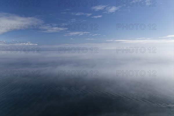 Coastal seascape in fog, Gulf of Saint Lawrence, Province of Quebec, Canada, sea, water, blue,