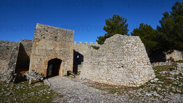 Sunny view of the entrance gate of an old fortress ruin, Chlemoutsi, High Medieval Crusader Castle,