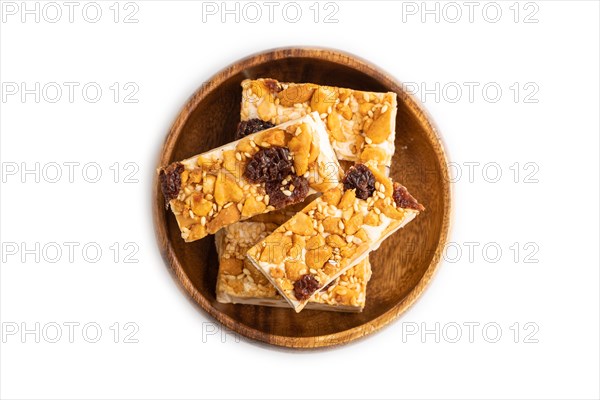 Traditional candy nougat with nuts and sesame isolated on white background. top view, flat lay,