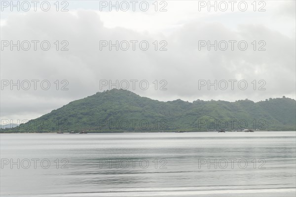 Lombok and Gili Air islands, overcast, cloudy day, sky and sea. Vacation, travel, tropics concept,