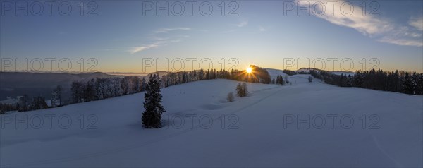 Sunset over the second Jura chain in winter, foreground contours of sinkholes, view towards the