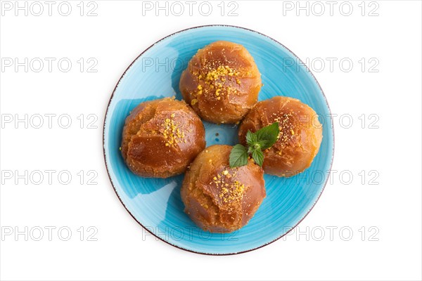 Homemade traditional turkish dessert sekerpare with almonds and honey isolated on white background.