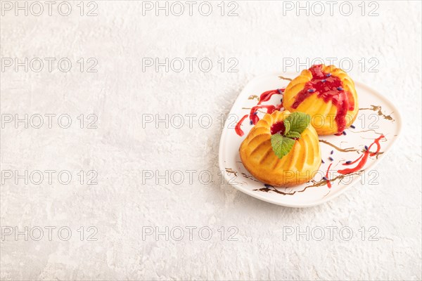 Semolina cheesecake with strawberry jam, lavender on gray concrete background. side view, copy