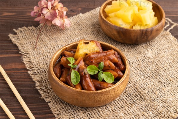 Tteokbokki or Topokki, fried rice cake stick, popular Korean street food with spicy jjajang sauce