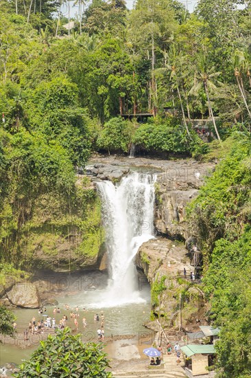 Tegenungan waterfall, Bali island, Ubud, Indonesia. Jungle, tropical forest, daytime with cloudy