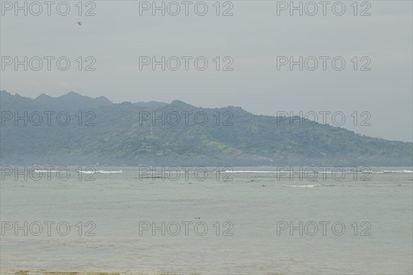 Lombok and Gili Air islands, overcast, cloudy day, sky and sea. Vacation, travel, tropics concept,