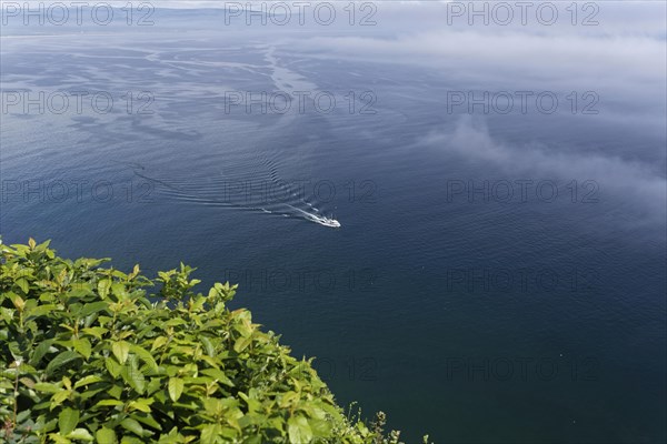Coastal seascape, fishing boat in fog, Gulf of Saint Lawrence, Province of Quebec, Canada, sea,