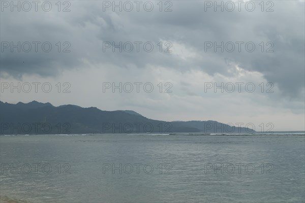 Lombok and Gili Air islands, overcast, cloudy day, sky and sea. Vacation, travel, tropics concept,