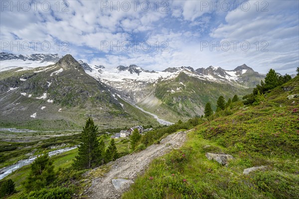 Picturesque mountain landscape with hiking trail, mountain hut Berliner Huette, mountain peak