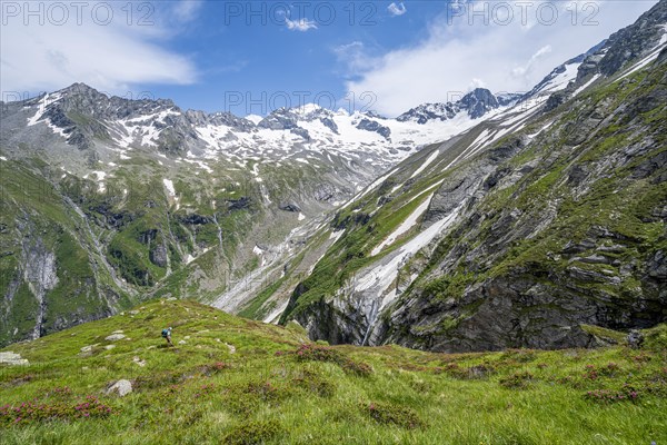 Picturesque mountain landscape with rocky mountains and glaciers, behind mountain peak Grosser