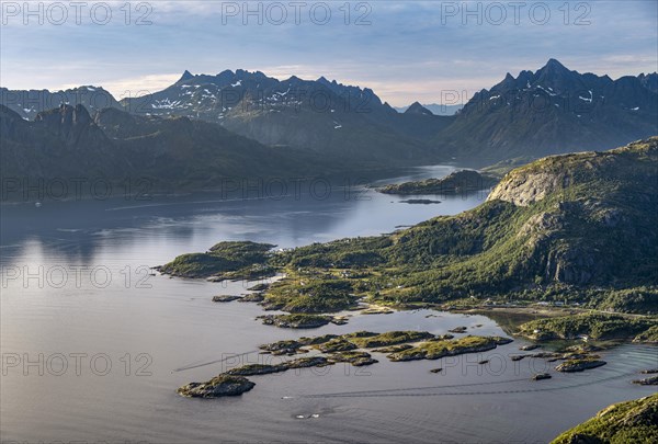 Fjord Raftsund and mountains in atmospheric evening light, view from the summit of Dronningsvarden