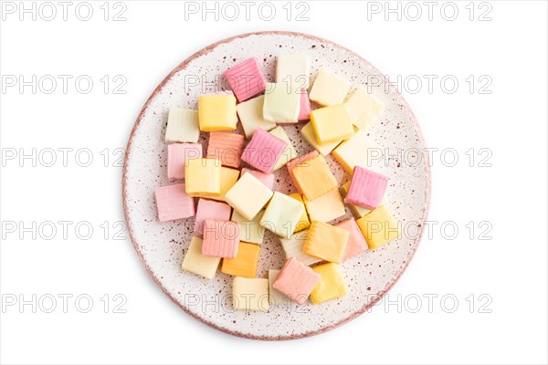 Various fruit jelly chewing candies on plate isolated on white background. apple, banana,