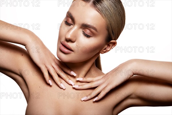 Beauty portrait of model with natural make-up. Fashion shiny highlighter on skin, sexy gloss lips