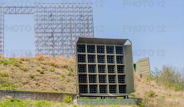 Military array of loud speakers and spot lights on hill overlooking DMZ observation area in