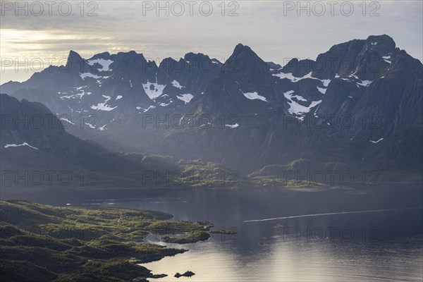Fjord Raftsund and mountains in atmospheric evening light, view from the summit of Dronningsvarden